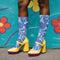 Psychedelic ankle socks featuring a bold blue and purple marble swirl pattern with black reinforced heel and toe, made from a stretchy polyester, nylon, and spandex blend, one size fits most, unisex, vibrant statement accessory for alternative and festival fashion lovers.