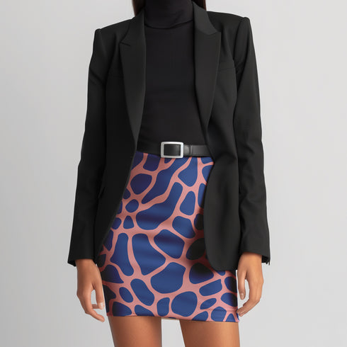 a woman in a black jacket and a pink and blue skirt