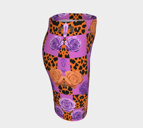 A vibrant, curve-hugging bodycon mini skirt featuring a maximalist mix of orange and purple checkerboard, black leopard print, and realistic rose florals in purple and orange tones. The high-waisted, mid-thigh cut is designed for a confident fit. Made from a durable performance knit fabric with two finish options: a signature UV reactive version that glows under blacklight for festivals and a dazzling glitter knit with reflective silver foil for a party-ready shimmer.