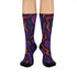 Mid-calf socks with a dark violet-black base featuring a gothic dagger and rose design in gradient shades of red, purple, and pink, with black heels and toes and an illustrated snake detail.