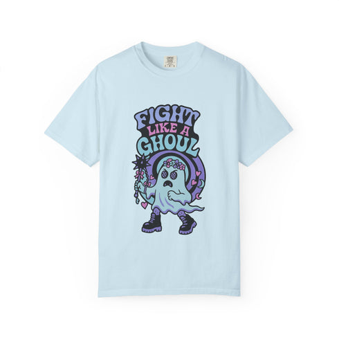 Unisex Comfort Colors 1717 t-shirt featuring a front print of a cute gothic ghost holding a mace wand with text reading "Fight Like A Ghoul." The ghost has floral details, combat boots, and pastel accents. Made of soft-washed, 100% ring-spun cotton with garment-dyed fabric and seamless tubular knit construction. Available in sizes S to 4XL.