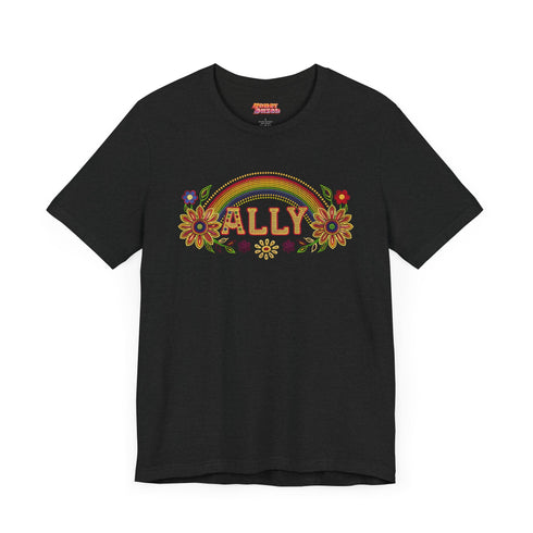 Black unisex t-shirt with "ALLY" in gold lettering under a rainbow arch, flanked by two large sunflower designs. LGBTQ+ pride ally shirt with folk art-inspired elements, available in cotton-poly blend, sizes S-3XL.