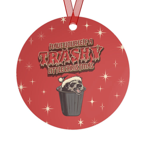 Round red metal Christmas ornament featuring angry possum in Santa hat emerging from trash can. Text reads "Have Yourself a Trashy Little Christmas" in dripping font with stars.