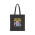 Canvas cotton tote bag with bold “Hex the Patriarchy” design printed on the front, featuring a dripping purple eye in a crystal ball surrounded by pastel potion bottles and hearts. Bag is available in black or natural cotton with long canvas handles.