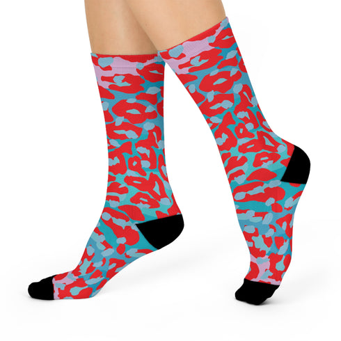 Dive into bold fashion with these vibrant socks featuring an eye-catching red, blue, and pink cheetah print pattern. Perfect for those who love to make a statement, these socks are ideal for brightening up any outfit and showcasing your unique style. Comfortable and stylish with black heels and toes, they are a must-have accessory for the fashion-forward.