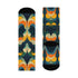 Crew socks featuring a bold ‘70s-style abstract swirl pattern in deep green, orange, yellow, and navy blue.