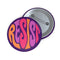 Close-up of a glossy, round purple pinback button. The button features the word "RESIST" in a bold, 70s-style psychedelic font that fills the entire surface. The bubbly, wavy letters alternate in color between a vibrant orange, a light peach-pink, and a deep magenta, creating a powerful and retro statement piece. The design has a distinct groovy and feminist protest aesthetic, making it a perfect accessory for jackets, bags, or activist apparel.