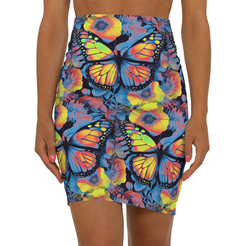 High-waisted bodycon mini skirt with an allover print of rainbow monarch butterflies and colorful tropical flowers on a dark background. Soft, stretchy poly-spandex fabric hugs the body for a flattering fit. Styled for rave, Y2K, and festival outfits. Sizes XS to XL.
