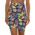 High-waisted bodycon mini skirt with an allover print of rainbow monarch butterflies and colorful tropical flowers on a dark background. Soft, stretchy poly-spandex fabric hugs the body for a flattering fit. Styled for rave, Y2K, and festival outfits. Sizes XS to XL.