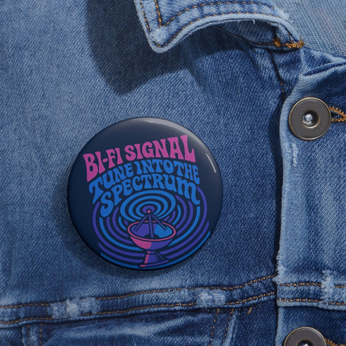 Round pinback button with glossy finish featuring the phrase “Bi-Fi Signal Tune Into the Spectrum” in pink and blue psychedelic lettering, with a satellite dish graphic, available in 2-inch and 3-inch sizes.