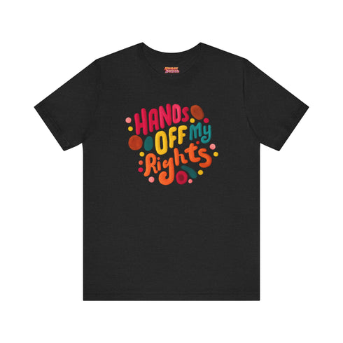 Black unisex t-shirt featuring vibrant "HANDS OFF MY RIGHTS" text design in multi-colored 3D-effect lettering. The words appear in red, yellow, teal, and pink with playful dots scattered around the text. The design has a vintage-inspired embroidery look on a soft cotton-polyester blend fabric. Available in Black and Heather Black options, sizes S-3XL, with a classic crew neck and short sleeves. Perfect for activism, protests, and making bold statements.