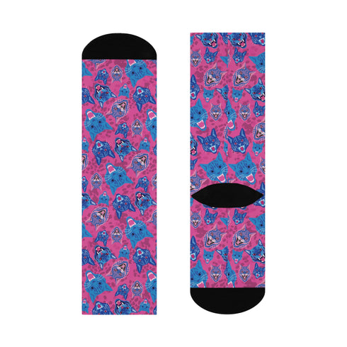 Fun and playful socks adorned with vibrant tiger head motifs on a pink background, with black heels and toes, ideal for animal lovers and those who enjoy unique designs