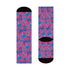 Fun and playful socks adorned with vibrant tiger head motifs on a pink background, with black heels and toes, ideal for animal lovers and those who enjoy unique designs