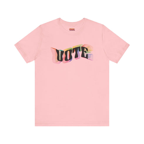 Election 2024 t-shirt with "VOTE" printed in large, colorful letters. Each letter features a different color from the rainbow spectrum, styled in a groovy 70s-inspired font.
