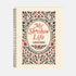 An 8.5 x 11 inch hardcover spiral-bound planner with a cream-colored cover featuring red and black folk art style floral illustrations. The cover reads "My Sh*tshow Life: A Field Guide" in a retro serif font. The planner has a durable satin matte laminated cover adhered to chipboard and a metal wire-o spiral binding available in gold or black. Interior pages are undated and include monthly and weekly layouts with sections for notes, to-do lists.