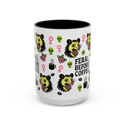 Possum Feminist Feral Before Coffee Mug (11, 15oz) features a tattoo-flash style with opossum heads, skulls, coffee motifs, and feminist symbols, ideal for goth or neurodivergent individuals seeking a bold, quirky morning statement piece.