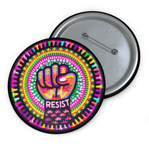 Round pinback button with psychedelic rainbow design featuring a raised black fist surrounded by concentric circles in vibrant pink, orange, green, and yellow. The word "RESIST" appears in white text below the fist, set against black background with flower details. Activist protest pin with glossy finish and safety pin backing.
