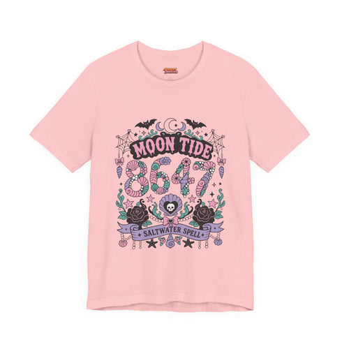 A short sleeve unisex crewneck t-shirt featuring a detailed Moon Tide 8647 graphic centered on the chest. The design includes bats, crescent moons, and spiderwebs at the top, with Moon Tide in a dripping font above a large 8647 rendered in shell patterned bubble numbers. The bottom features a skull inside a scallop shell, roses, and a Saltwater Spell banner. The color palette uses mint green, lilac, and salmon pink with black outlines. The shirt is shown in light pink, lavender, and cream.
