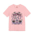 A short sleeve unisex crewneck t-shirt featuring a detailed Moon Tide 8647 graphic centered on the chest. The design includes bats, crescent moons, and spiderwebs at the top, with Moon Tide in a dripping font above a large 8647 rendered in shell patterned bubble numbers. The bottom features a skull inside a scallop shell, roses, and a Saltwater Spell banner. The color palette uses mint green, lilac, and salmon pink with black outlines. The shirt is shown in light pink, lavender, and cream.