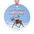 Round blue metal Christmas ornament featuring Glenn Danzig in sunglasses and Christmas lights riding reindeer through snowy landscape. Text reads "Last Caress of Christmas" in icy font.
