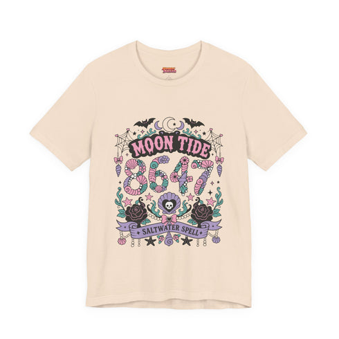 A short sleeve unisex crewneck t-shirt featuring a detailed Moon Tide 8647 graphic centered on the chest. The design includes bats, crescent moons, and spiderwebs at the top, with Moon Tide in a dripping font above a large 8647 rendered in shell patterned bubble numbers. The bottom features a skull inside a scallop shell, roses, and a Saltwater Spell banner. The color palette uses mint green, lilac, and salmon pink with black outlines. The shirt is shown in light pink, lavender, and cream.