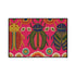 A rectangular doormat featuring a vibrant hot pink background with a high-fidelity tapestry-style print of three large, detailed beetles. The central beetle is emerald green and gold with navy accents, flanked by two side-profile beetles in ochre and deep blue. Stylized teal and yellow sunburst flowers and small sage green leaves are scattered throughout the design. The mat has a sleek black-trimmed edge and a visible flat, durable polyester texture mimicking intricate needlework.