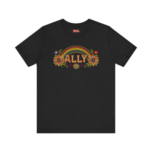 Black unisex t-shirt with "ALLY" in gold lettering under a rainbow arch, flanked by two large sunflower designs. LGBTQ+ pride ally shirt with folk art-inspired elements, available in cotton-poly blend, sizes S-3XL.