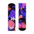 Black crew socks featuring an oversized, abstract strawberry pattern in bright pink, blue, and orange.