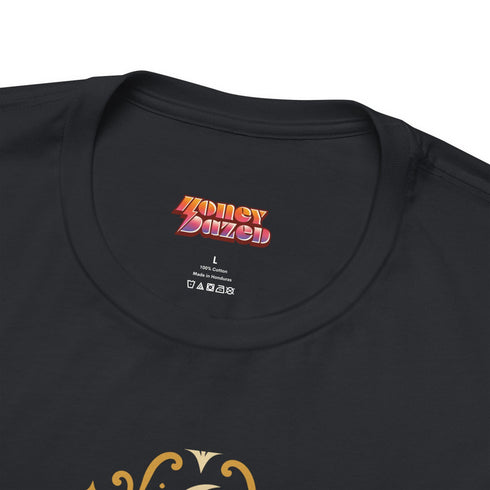 A black unisex crewneck graphic t-shirt featuring an ornate Victorian-inspired emblem printed on the chest in vintage gold and off-white. The centralized, symmetrical design showcases a classic coffin with a cross on the lid, flanked by wrought-iron cemetery gates. Beautiful scrollwork and decorative filigree flourishes surround the bold, retro serif text reading CEMETERY PICNIC SOCIETY. A crescent moon and stars sit at the top, completing this gothic memento mori graphic shirt.