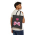 Canvas tote bag featuring pink skull cherries design. Two pink skulls connected by red stem and bow. Quirky gothic-inspired graphic on cream background. Stylish, edgy accessory for everyday use. Perfect for alternative fashion lovers.