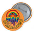 Round orange pinback button featuring bold rainbow psychedelic artwork of a melting third-eye face beneath a rainbow arch. Surrounded by stars and the phrase “Hot, Queer and Radiating” in retro black bubble letters. Glossy metal badge with UV-resistant mylar face and secure safety pin back.