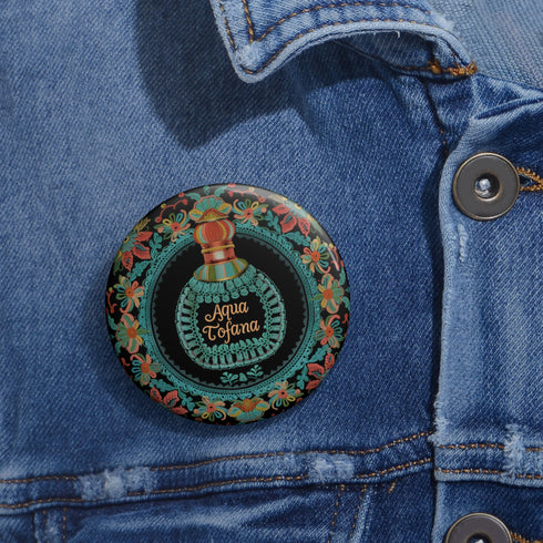Circular pinback button featuring an ornate teal poison bottle labeled "Aqua Tofana" on black background, framed by decorative coral and turquoise flowers. Gothic feminist history pin with glossy finish and safety pin backing, available in 2" and 3" sizes for witch aesthetic fashion.