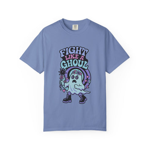 Unisex Comfort Colors 1717 t-shirt featuring a front print of a cute gothic ghost holding a mace wand with text reading "Fight Like A Ghoul." The ghost has floral details, combat boots, and pastel accents. Made of soft-washed, 100% ring-spun cotton with garment-dyed fabric and seamless tubular knit construction. Available in sizes S to 4XL.