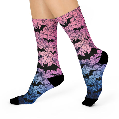 Black crew socks featuring an ombre pink-to-blue gradient with silhouetted bats and spiderweb details.