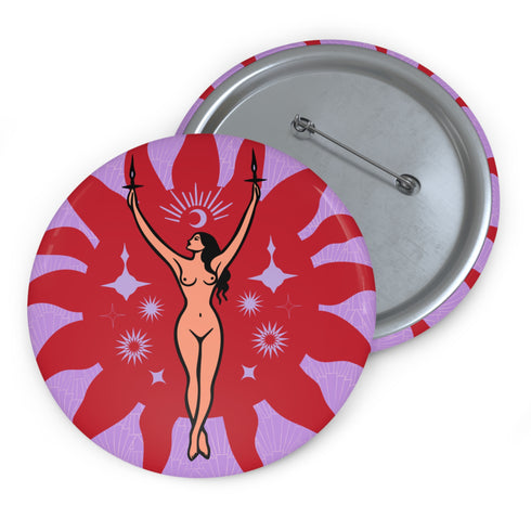 Circular pin featuring a nude goddess figure in gold against a red sunburst pattern on lavender background, with moon and star details