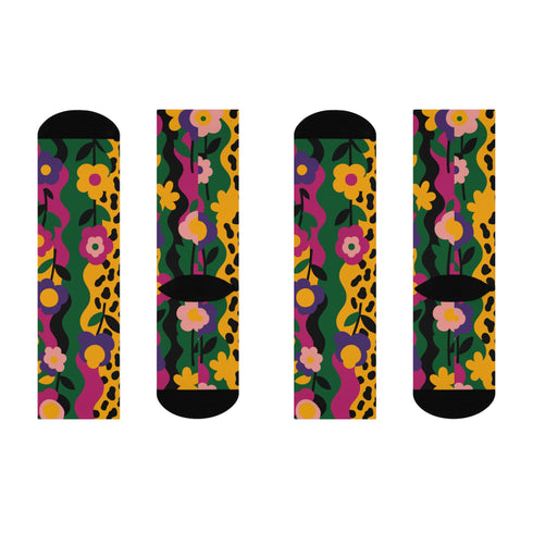 Colorful dopamine-infused crew socks with an all-over print featuring abstract flowers and leopard spots in bold hues of pink, purple, yellow, green, and black. Made of plush polyester-spandex blend, with black toe and heel accents. Designed to fit women’s US 5 to men’s US 12 shoe sizes.