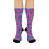Fun and playful socks adorned with vibrant tiger head motifs on a pink background, with black heels and toes, ideal for animal lovers and those who enjoy unique designs