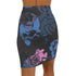 High-waisted black mini skirt with a bodycon fit, featuring a bold allover floral graphic print in pink and blue. Made of stretchy polyester-spandex blend with a smooth finish. Styled in various festival and streetwear looks. Available in sizes XS to XL.