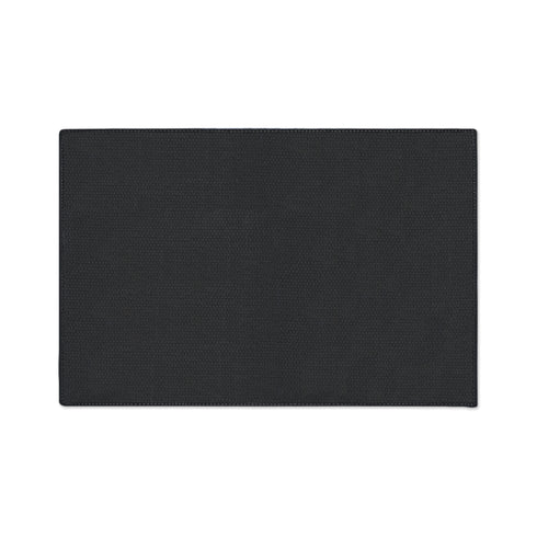 High-fidelity printed doormat featuring a "Space Kitty" design in a tapestry-style faux-texture. A black cat with large yellow eyes wears a golden ribbed space helmet, centered on a deep navy background. The cat is surrounded by oversized, vibrant magenta and pink folk-art flowers with chartreuse and olive green leaves. The design uses a printed illusion to mimic 3D embroidery stitching. The mat is rectangular with a sleek black border and a non-slip backing.