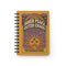 A glossy 5x7 inch spiral bound notebook featuring the phrase Inner Peace Outer Chaos in retro 70s typography. The cover showcases a vibrant psychedelic design on a mustard yellow background with a central trippy sun motif containing three mystical eyes. Below the sun, text reads Meditations, Mantras, and Meltdown Notes in bold black font. The journal has a durable black metal spiral binding and contains 150 lined pages for writing, shadow work, or daily planning.