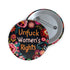 Round pinback button with black background featuring vibrant floral embroidery design surrounding bold orange and white text reading "Unfuck Women's Rights" - feminist protest accessory with glossy finish, safety pin backing, available in 2" and 3" sizes for jackets, bags, and activist wear.