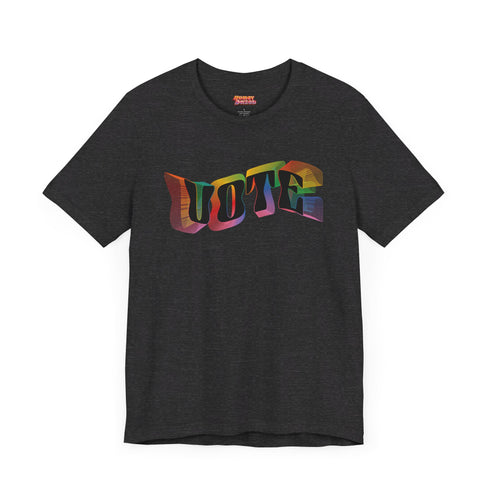 Election 2024 t-shirt with "VOTE" printed in large, colorful letters. Each letter features a different color from the rainbow spectrum, styled in a groovy 70s-inspired font.