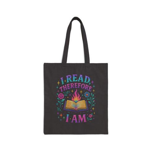 Natural cotton canvas tote bag featuring a vibrant, double-sided print that reads “I Read Therefore Therefore I Am” with a flaming book, stars, and flowers in a colorful pastel palette. Styled against street art backdrops, worn with playful, alternative fashion. A bold, bookish accessory for literary lovers, pastel goths, and dopamine-dressed readers who carry their brainy attitude everywhere.
