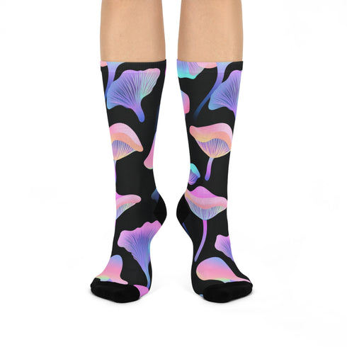 Black crew socks with an allover design of iridescent neon mushrooms in shades of pink, blue, and purple.