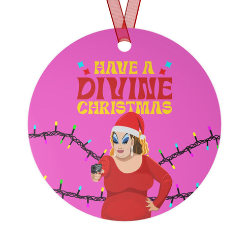 Round purple metal Christmas ornament featuring Drag Queen Divine in Santa hat and red dress with colored Christmas lights. Text reads "Have A Divine Christmas" in retro psychedelic lettering.