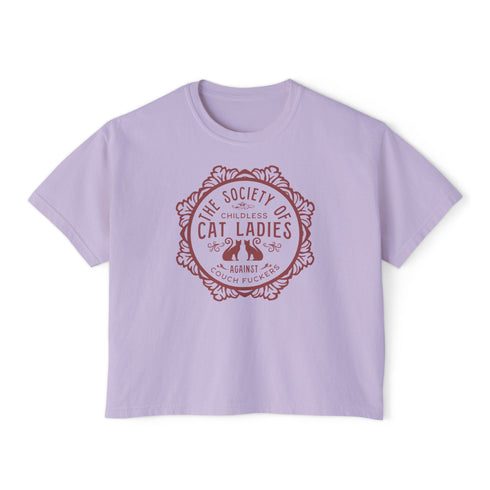The Society of Childless Cat Ladies Against Couch Fuckers" 2024 election T Shrort design featuring two cats in an ornate circular frame, available in white and purple.