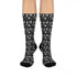 Black crew socks featuring a white skull and cherry pattern.
