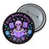 Literary rebel's badge of honor. Black circular button featuring a neon purple skeleton surrounded by floating books and stars. The text 'READ BANNED BOOKS' arcs across the top in bold purple lettering. Perfect for book-loving misfits who devour forbidden knowledge.