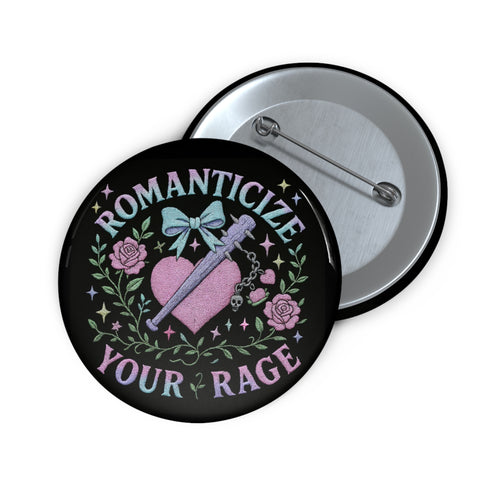 Glossy black pinback button featuring pastel gothic artwork with the phrase "Romanticize Your Rage" in bold white and lavender lettering. The design includes a pink glitter heart, a silver dagger, mint green bow, roses, stars, and delicate vines. Styled against a pink and purple gradient background, this round button blends soft romantic visuals with fierce messaging, perfect for pastel goth, feminist, or alternative fashion aesthetics.