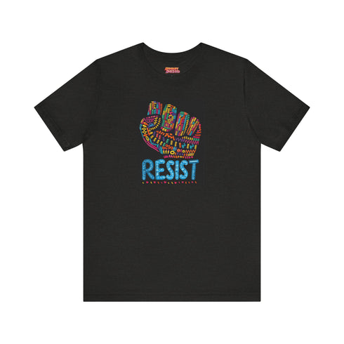 Black t-shirt with vibrant multicolored patterned raised fist graphic and blue "RESIST" text underneath. Rainbow activist protest shirt with psychedelic design elements on cotton-polyester blend.